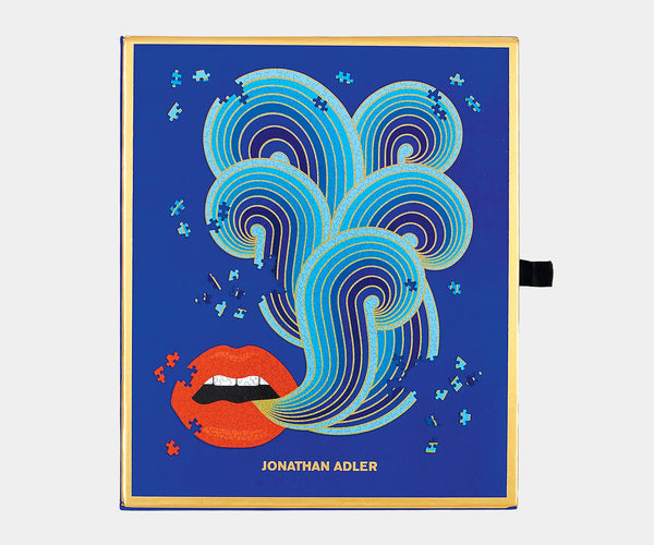 Luxury jigsaw puzzle by Jonathan Adler featuring iconic lips design for stylish home décor.