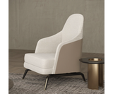 High-back Summers armchair offering comfort and elegance in a refined living space.