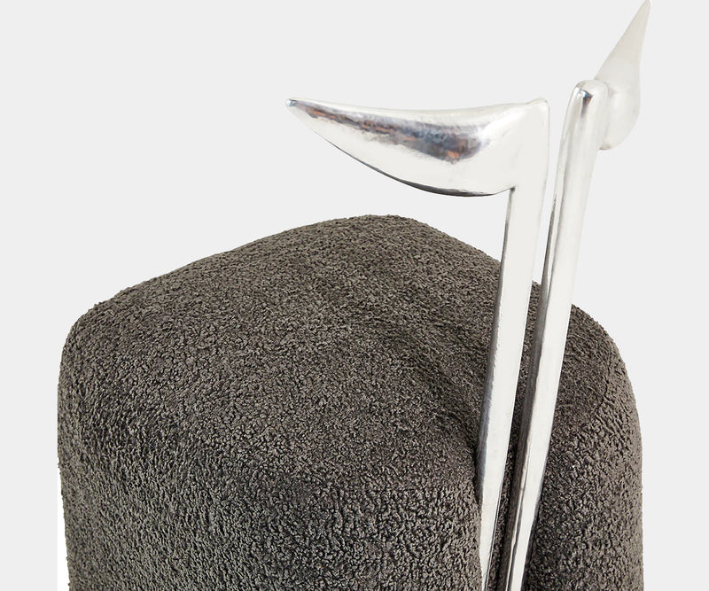 Strelitzia dining chair featuring a luxurious silver aluminium finish and plush charcoal bouclé upholstery, perfect for high-end dining decor.