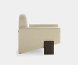 Contemporary Taito Armchair adding a touch of luxury to upscale living spaces.