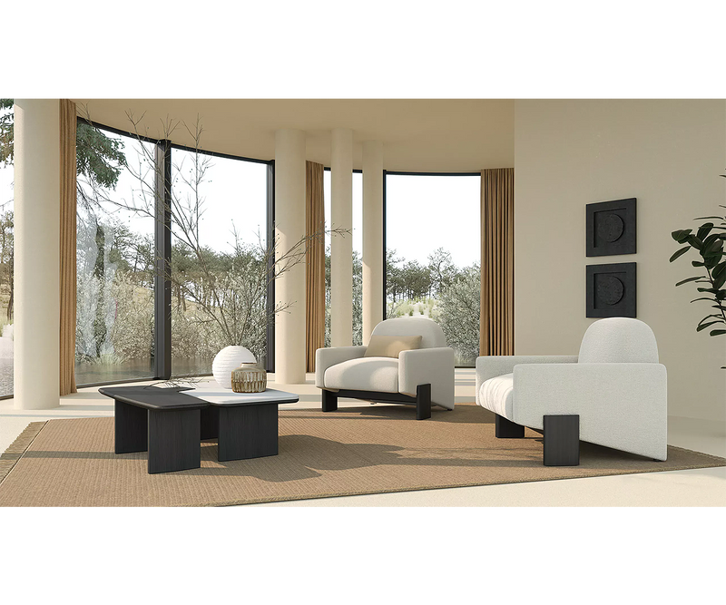 Modern Taito Armchair with unique black oak base and luxurious fabric for stylish interiors.