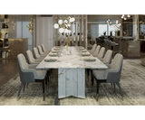 Luxxu Algerone dining table with polished brass and sleek architectural design