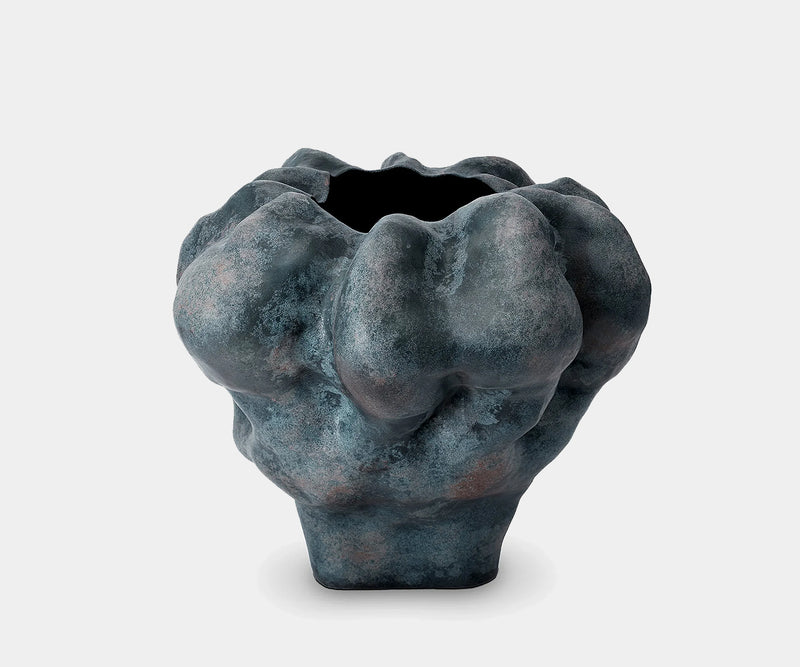 Hand-sculpted Timna Vase in porcelain with earthy tones, perfect for luxury home decor.