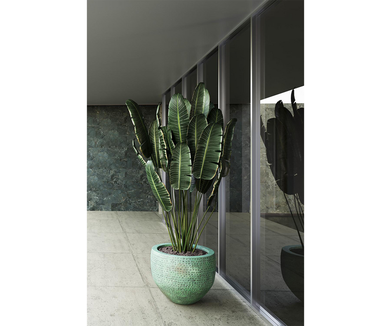 Bold turquoise planter set creating a striking focal point in luxury interiors.