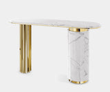 Luxury entryway featuring a Carrara marble console table with brass accents.