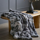 Cloudspun Marble Faux Fur Throw. Luxuriously soft, faux fur throw in a stunning grey and white marble pattern. Perfect for adding a touch of modern elegance to any room.