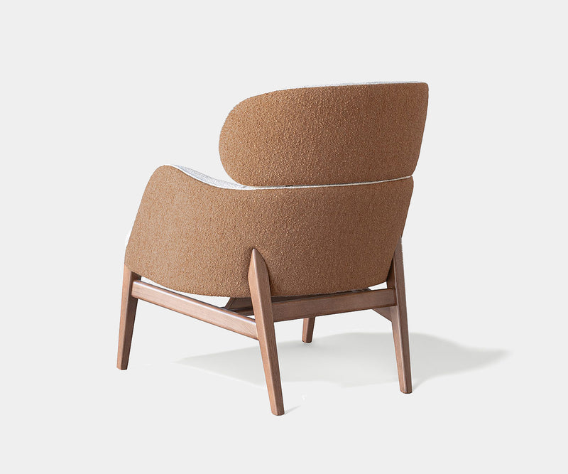 Premium Dafne Armchair with fluid lines, perfect for contemporary interiors.