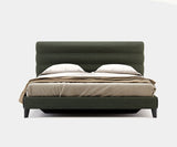 Yumi luxury bed with minimalist design and padded headboard in a modern bedroom setting.