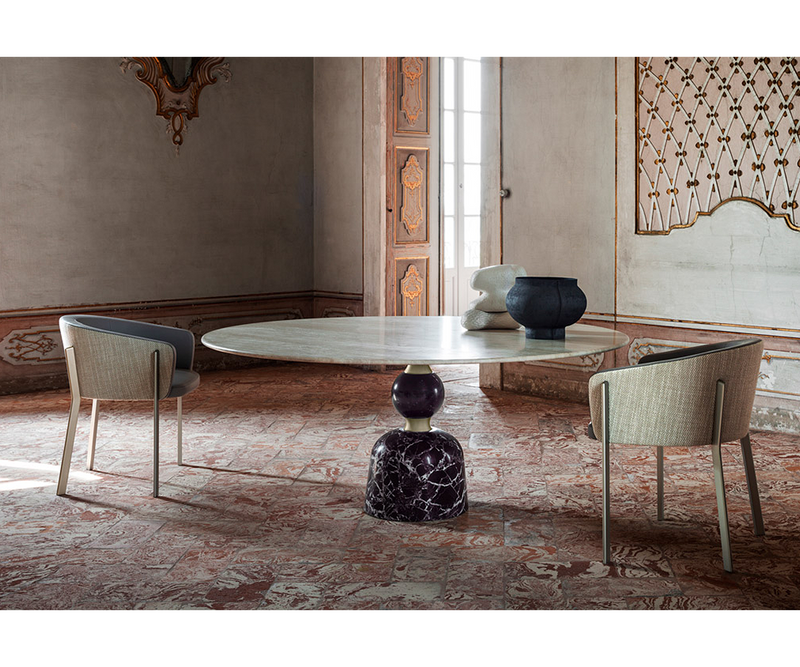 High-end marble and brushed metal Artù dining table, perfect for luxury real estate interiors.