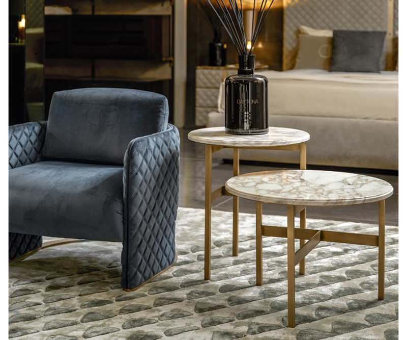 Daytona Playful Armchair: Add a touch of personality to your home with the Daytona Amy armchair, a playful design with a luxurious burnished brass base.