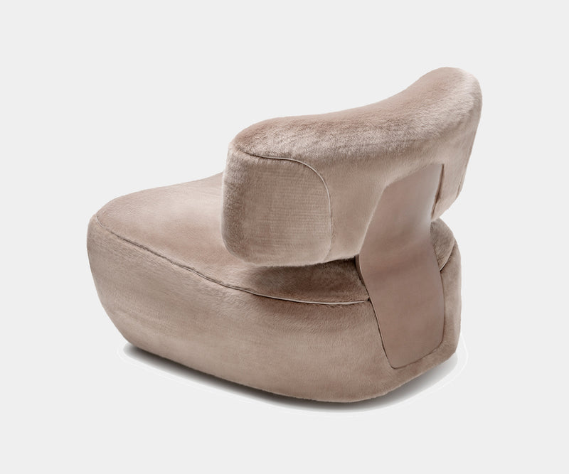 Designer armchair, Mira, provides exceptional comfort with its soft upholstery.