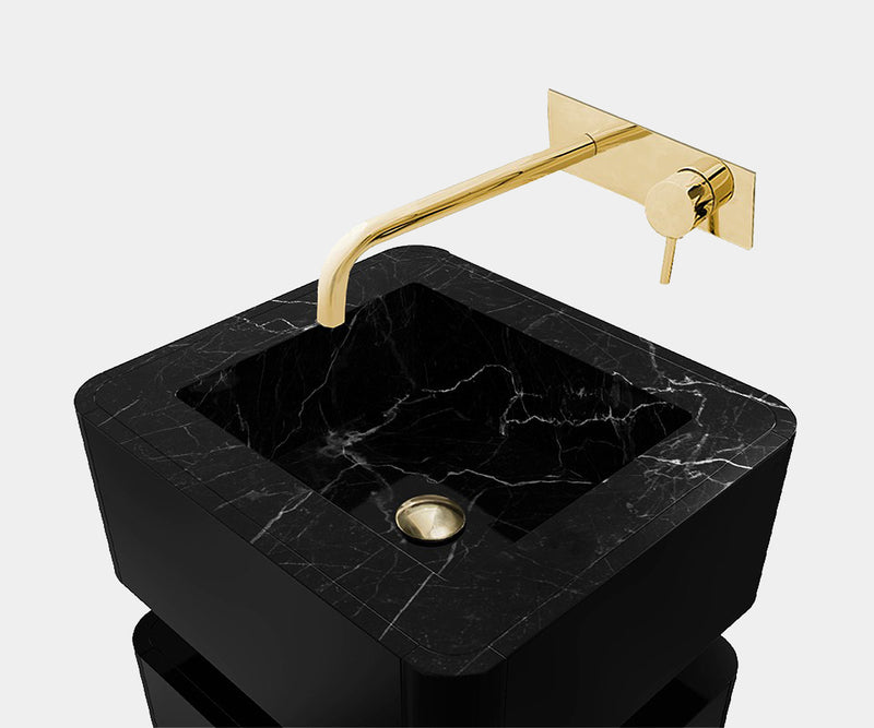 Contemporary pedestal sink with Nero Marquina marble and high-gloss black lacquer, perfect for luxury bathroom interiors.