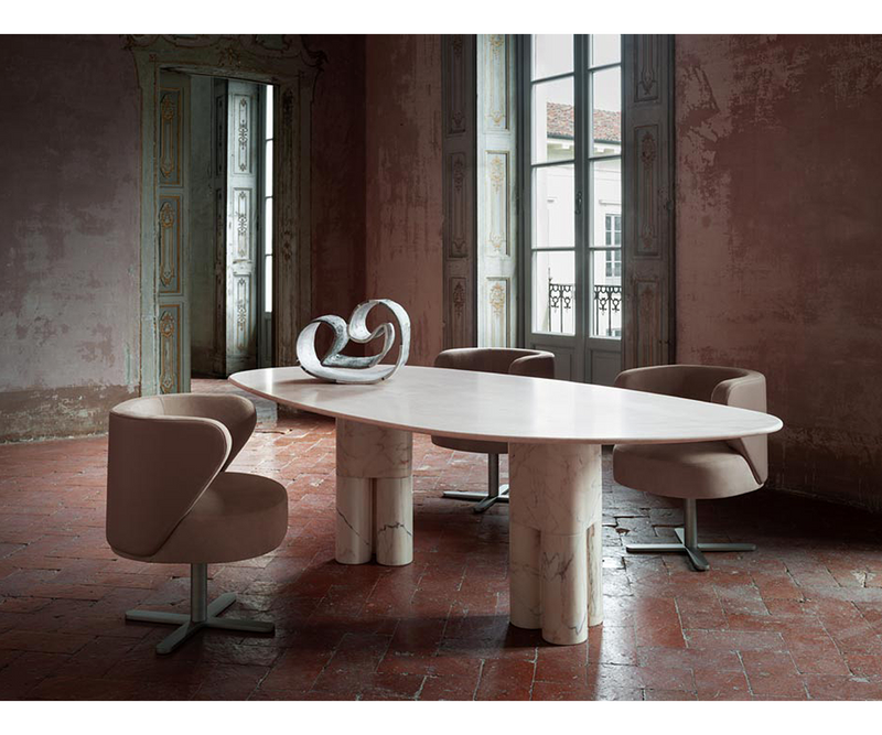 Organic and fluid lines of the Tria Dining Table, representing the beauty of nature in luxury home furnishings.