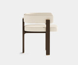 Elegant Karl dining chair made from eucalyptus wood with brass details.