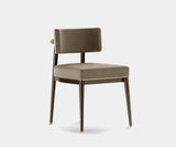 Frank minimalist dining chair with moka oak wood frame and subtle brass accents.