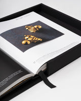 Delve into the History, Symbolism, and Art of Gold - Explore the multifaceted story of gold, from its historical significance to its use in art, with this captivating coffee table book.