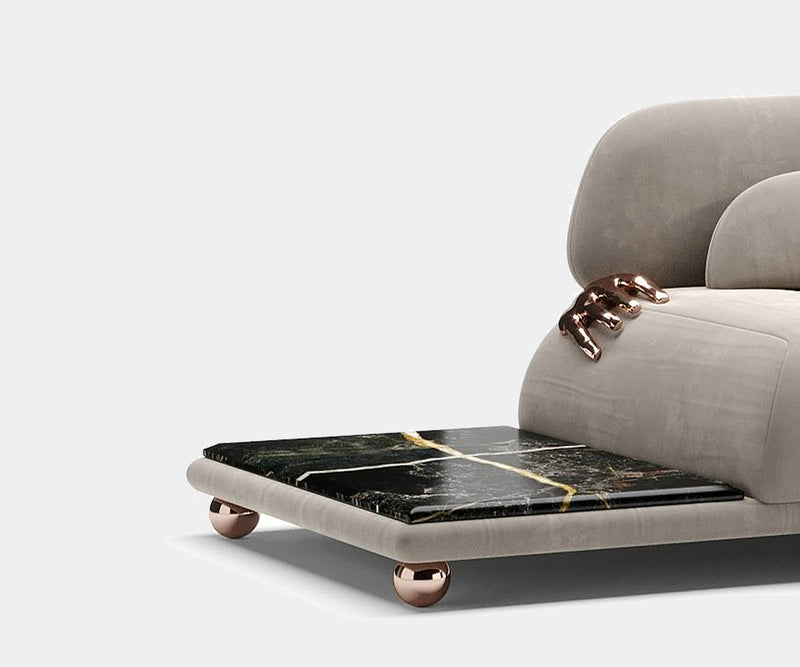 Elegant Pompeii Sofa with intricate brass sculptures, perfect for contemporary luxury interiors