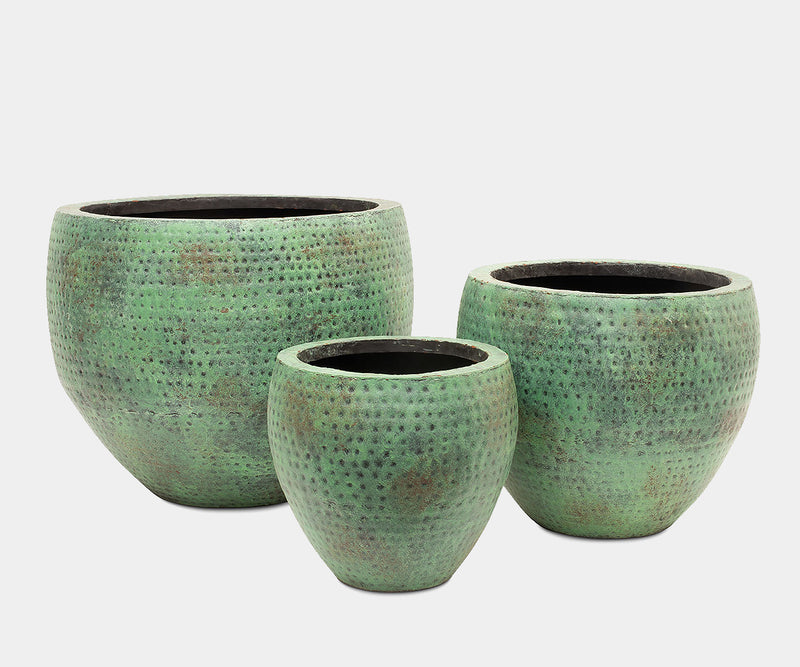 Handcrafted turquoise planter set adding vibrant colour to luxury home decor.