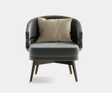 Comfortable custom armchair with a modern design, perfect for sophisticated living spaces.