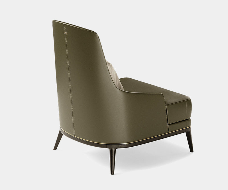 Elegant Aster Redd armchair with plush seating and flowing lines, adding a touch of luxury to living room furniture.