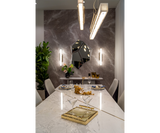 Contemporary Statuario marble dining table with polished brass accents by Luxxu