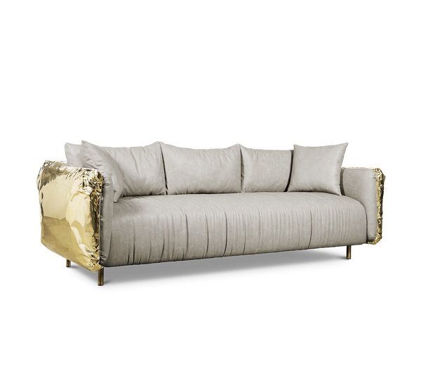 Embrace the beauty of imperfection with the Imperfectio Sofa. The hand-hammered brass base adds a touch of artisanal character.