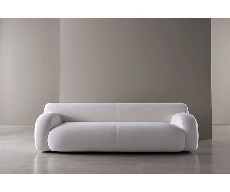 Italian designer sofa by Meridiani, Oscar model with soft curves and customisable modular seating options.