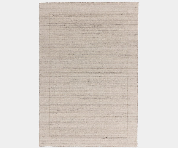 Larson Ivory luxury rug made from natural wool for modern, elegant interiors.