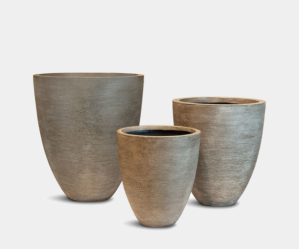 Versatile Grey Planters: Decorative planters that integrate seamlessly into various landscaping styles, enhancing outdoor aesthetics.