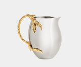 L'Objet Fern Pitcher in luxury stainless steel with 24k gold accents, perfect for elegant dining and entertaining.