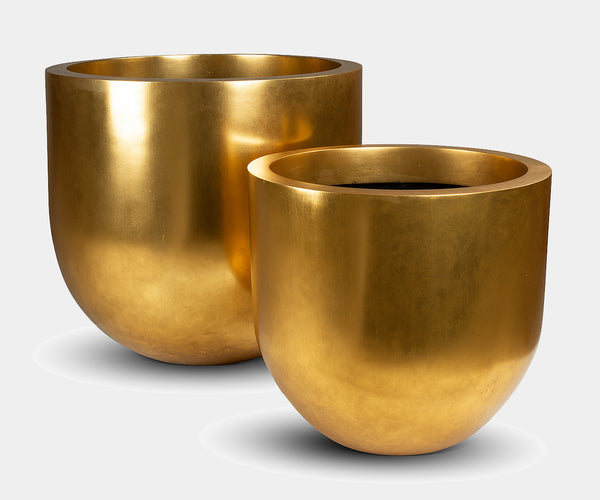 Luxurious gold-leaf Pandora floor planter showcased in an elegant indoor living space.