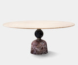 Luxury Artù dining table with a circular marble top and sculptural metal base for high-end home decor.