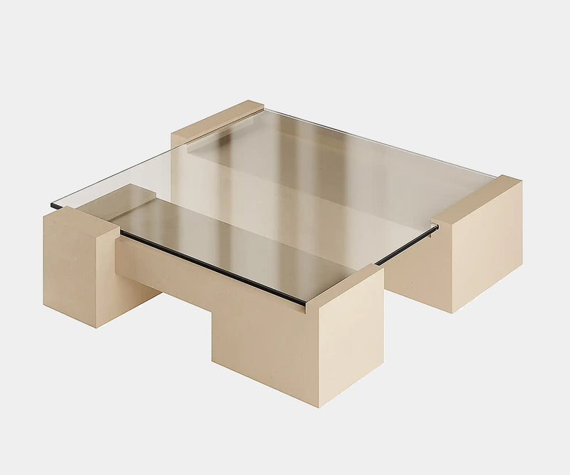 Elegant sand-coloured micro-cement centre table with minimalist design and geometric forms.