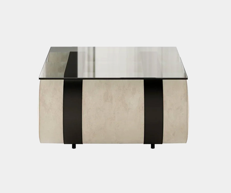 High-end brutalist design centre table with glass surface and textured velvet base for sophisticated living spaces.