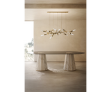 Luxxu Darian luxury dining table in walnut root, brass, and modern smoked glass