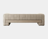 Designer sofa adding sophistication and warmth to a luxury living room.