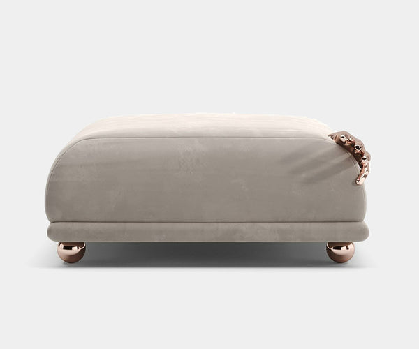 Luxury rose gold Pompeii Ottoman by Nauu Design in high-end interior setting