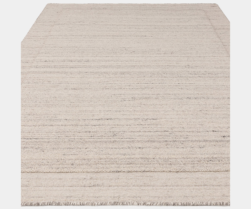 Neutral-toned Larson Ivory rug adding sophistication to luxury home decor.