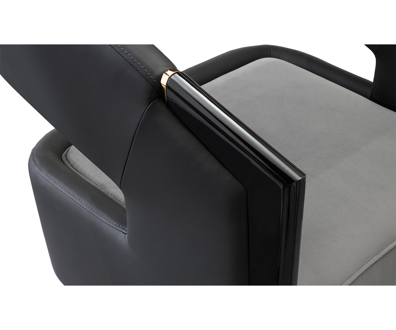 Detailed view of the Luxxu Gladia Armchair’s plush velvet upholstery and polished brass frame.