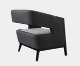 Luxxu Gladia Armchair offering ultimate comfort with its plush grey velvet and elegant brass trim.