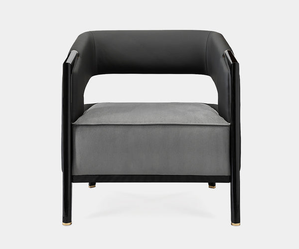 Close-up of the Luxxu Gladia Armchair showcasing black lacquered wood and plush velvet seat.