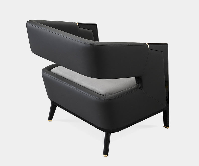 Stylish Luxxu Gladia Armchair placed in a contemporary setting, combining modern design and luxurious materials.