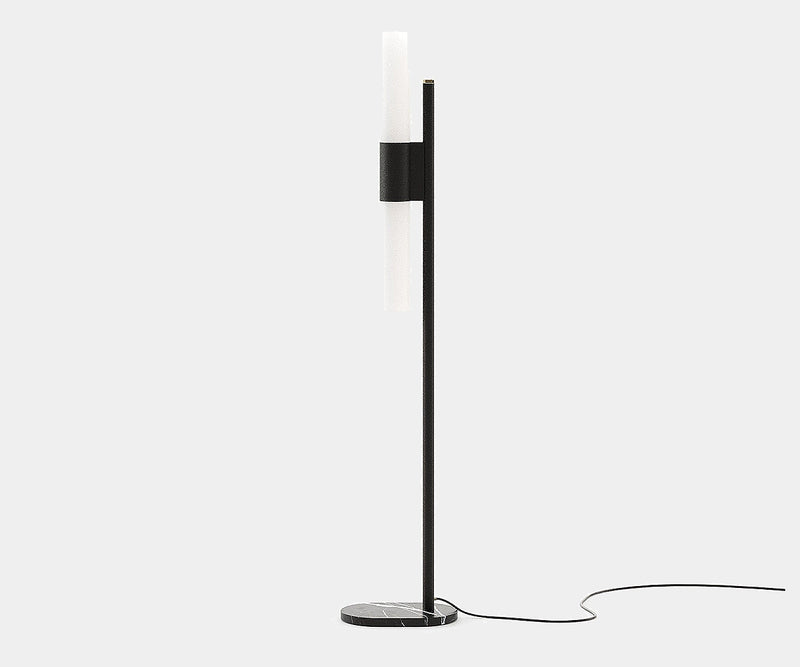 Contemporary floor lamp with marble base and iron construction, adding sophistication to modern interiors.