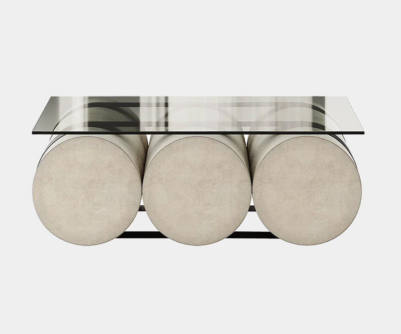 Luxury coffee table with a tempered glass top and plush velvet base, ideal for high-end interior design.