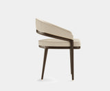 Elegant Erick Dining Chair with a rounded backrest for modern dining rooms.