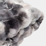 Elevate your modern living room decor with the Grey and White Marble Throw. This plush faux fur throw adds a touch of texture and luxury to any space.
