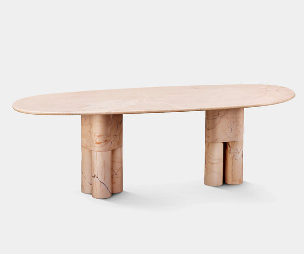 Tria Dining Table featuring luxurious Portuguese pink marble in a sculptural organic design for high-end home decor.