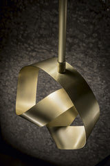 Sculptural wall lamp with artisanal flair for upscale interiors