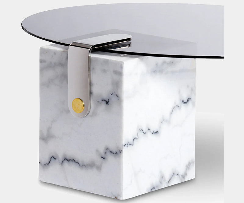 Modern white marble coffee table with brass accents and a unique patch design, ideal for adding luxury and style to upscale home decor.