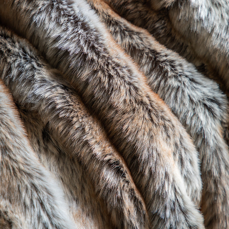 Experience the luxurious comfort of the Silky Luxe Faux Fur Throw. This incredibly soft throw features a subtle striped pattern and is perfect for adding a touch of texture and wild style to your home.